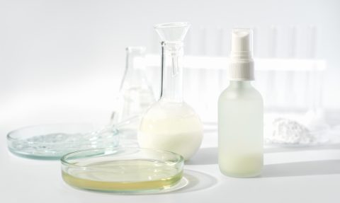 image 8 fermented beauty concept. petri dishes, laboratory glassware and cosmetic product on a table. enzyme cosmetology ingredient.